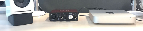 A speaker, a Focusrite interface and a Mac Mini