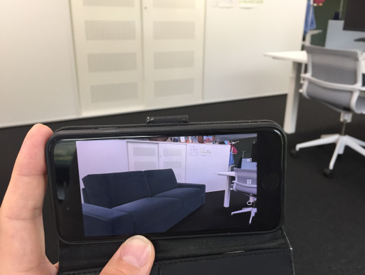 Hand-held AR on an iPhone: the Ikea Place app showing a virtual couch
