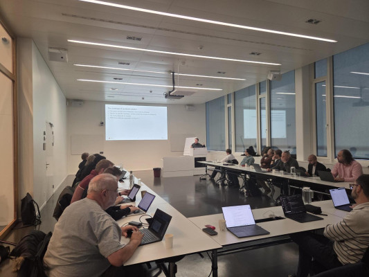 Everyone sitting down for the day's presentations